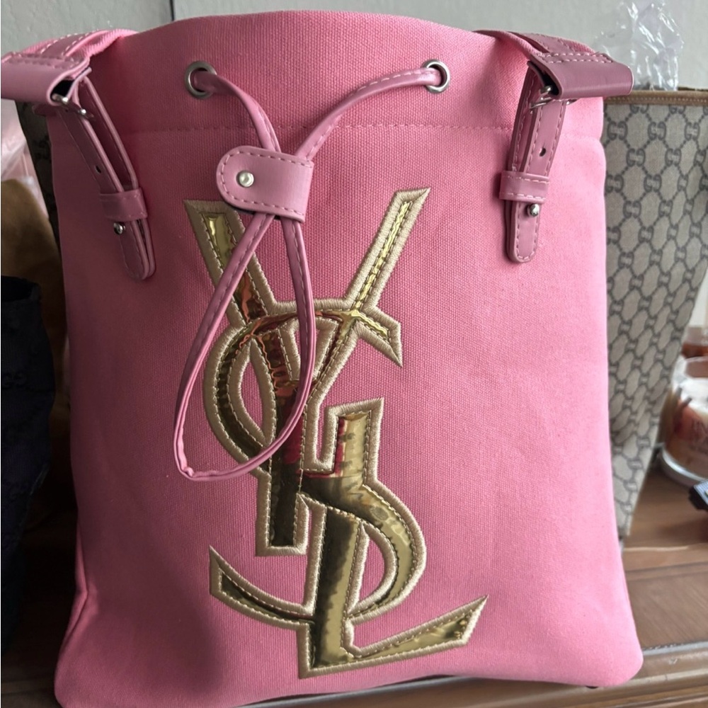 Yves Saint Laurent Pink Drawstring Bucket Bag with Gold Logo
